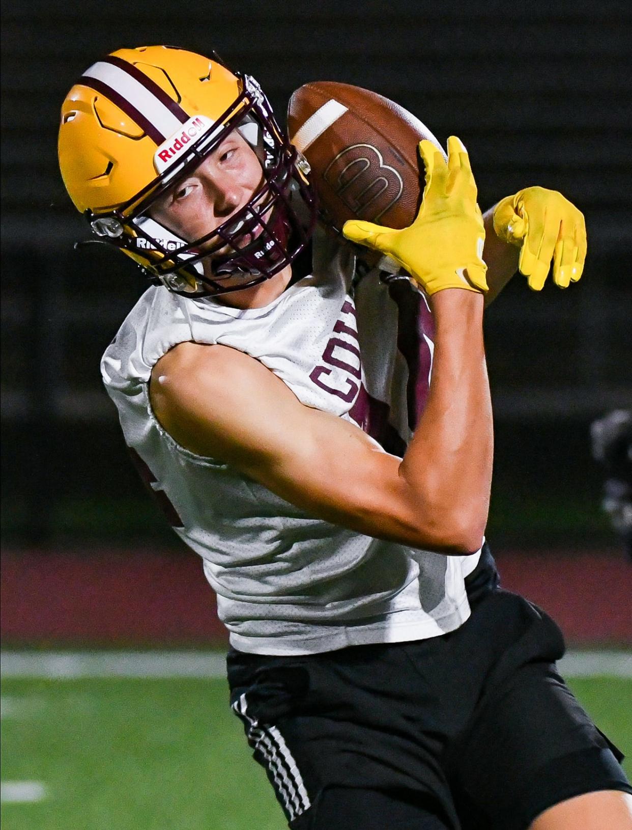 Bloomington North’s Cole Grupenhoff catches a pass during the first day of football practice at North on Monday, July 31, 2023.