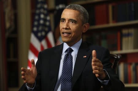 U.S. President Barack Obama speaks during an exclusive interview with Reuters in the Library of the White House in Washington March 2, 2015. REUTERS/Kevin Lamarque