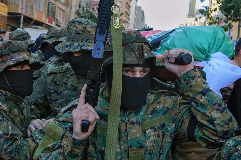 Islamic Group members known as Jamaa Islamiya carry the body of their comrade Mohammad Riad Mohyeldin, who was killed in an Israeli strike, during his funeral procession in Beirut, Lebanon, Tuesday, March 12, 2024. The Secretary-General of al-Jamaa al-Islamiya, or the Islamic Group, Sheikh Mohammed Takkoush allied with Hamas and Hezbollah said Tuesday, March 26, 2024 they are closely coordinating with both groups along the southern border with Israel where they have claimed responsibility for several attacks over the past months. (AP Photo/Bilal Hussein)