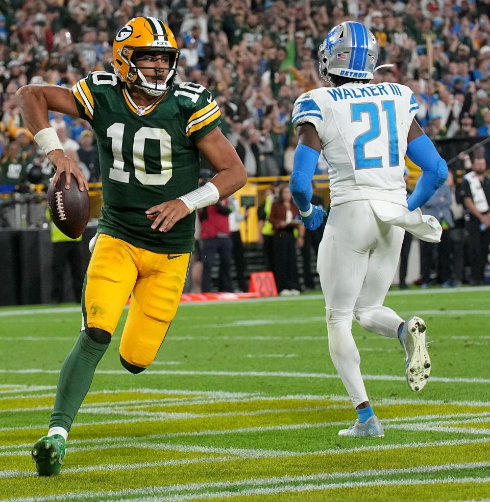 Green Bay Packers quarterback Jordan Love runs nine and for a touchdown during the fourth quarter of their game Thursday, September 28, 2023 at Lambeau Field in Green Bay, Wis. The Detroit Lions beat the Green Bay Packers 34-20.