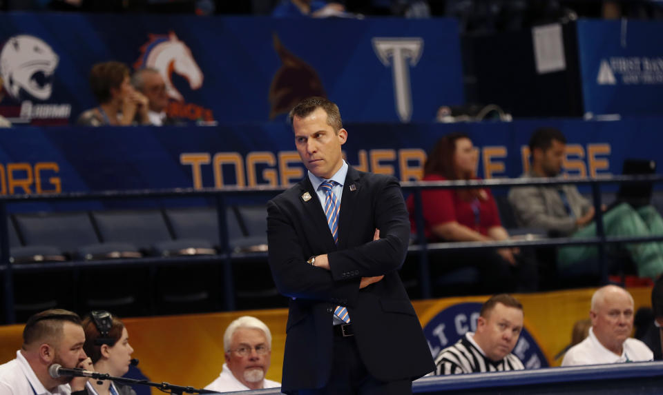 Texas-Arlington head coach Scott Cross watches from the bench in the first half of the the Sun Belt Conference NCAA college basketball championship game against Texas-Arlington in New Orleans, Sunday, March 11, 2018. (AP Photo/Gerald Herbert)