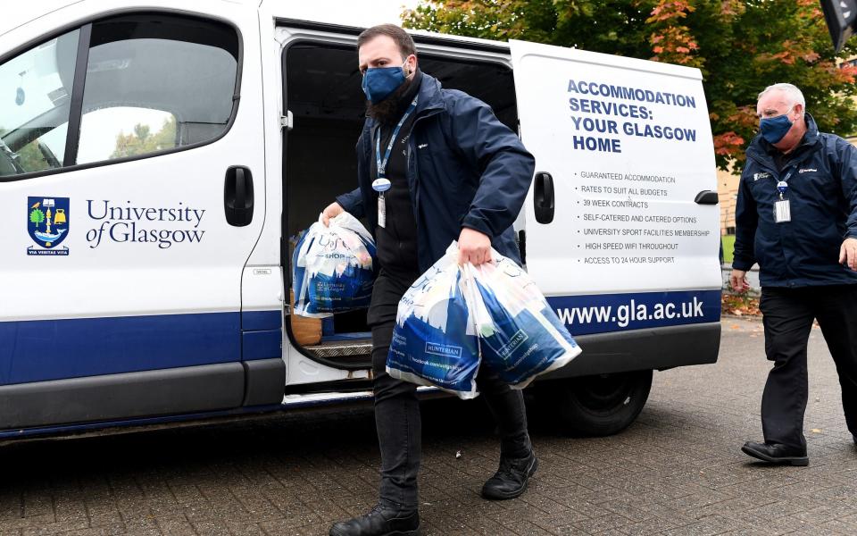 Food parcels are delivered for students at Murano Street student village on September 28 - Getty Images Europe