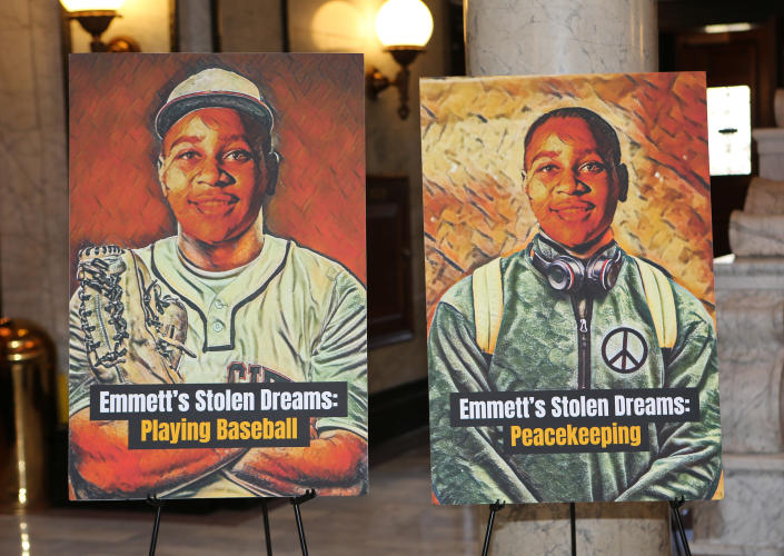 Signs illustrating what was stolen when Emmett Till lost his life read: Emmett&#39;s Stolen Dreams: Playing Baseball and  Emmett&#39;s Stolen Dreams: Peacekeeping.