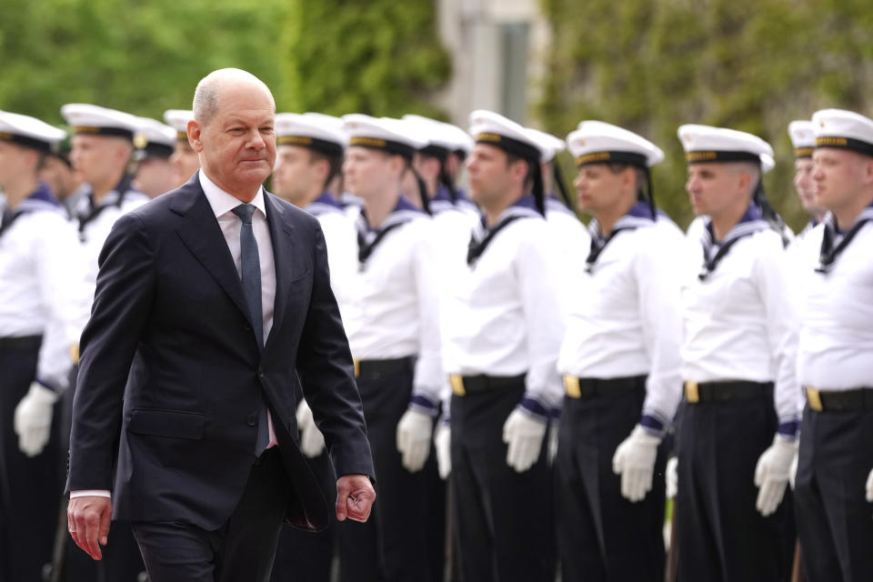 Germany's Chancellor Olaf Scholz walks past soldiers of the German Armed Forces as he prepares to greet Ukraine's President Volodymyr Zelenskyy at the chancellery in Berlin, Germany, Sunday, May 14, 2023. Ukrainian President Volodymyr Zelenskyy arrived in Berlin early Sunday for talks with German leaders about further arms deliveries to help his country fend off the Russian invasion and rebuild what's been destroyed by more than a year of devastating conflict. (AP Photo/Matthias Schrader)