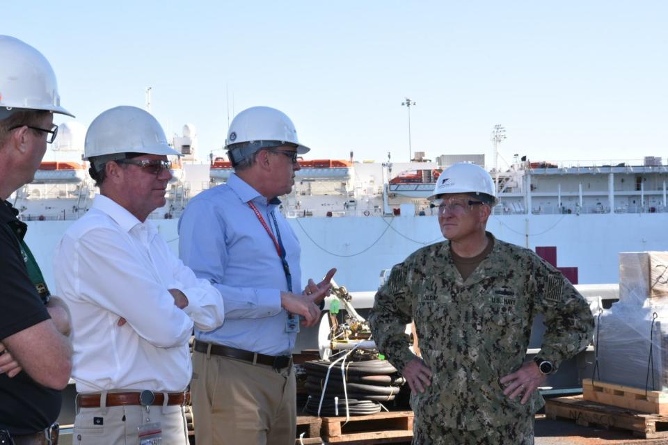Chief of Naval Operations Adm. Mike Gilday, right, speaks with a NASSCO official during a visit to the yard on Feb. 18, 2022. (Cmdr. Courtney Hillson/U.S. Navy)