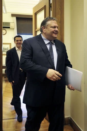 Leader of the Greek socialist party, Evangelos Venizelos, (R) leavs the office of the leader of the Coalition of the Radical Left party