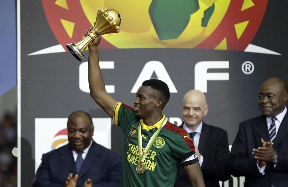 Cameroon's Benjamin Moukandjo lifts the trophy after winning the African Cup of Nations final soccer match between Egypt and Cameroon at the Stade de l'Amitie, in Libreville, Gabon, Sunday, Feb. 5, 2017. Cameroon won 2-1. (AP Photo/Sunday Alamba)