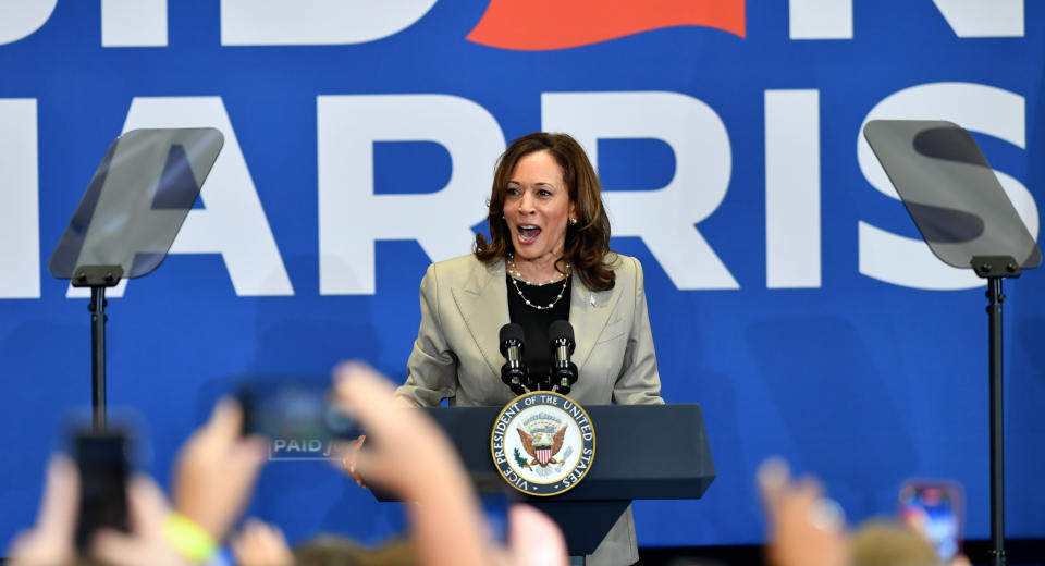 Vice President Kamala Harris stands at a podium.