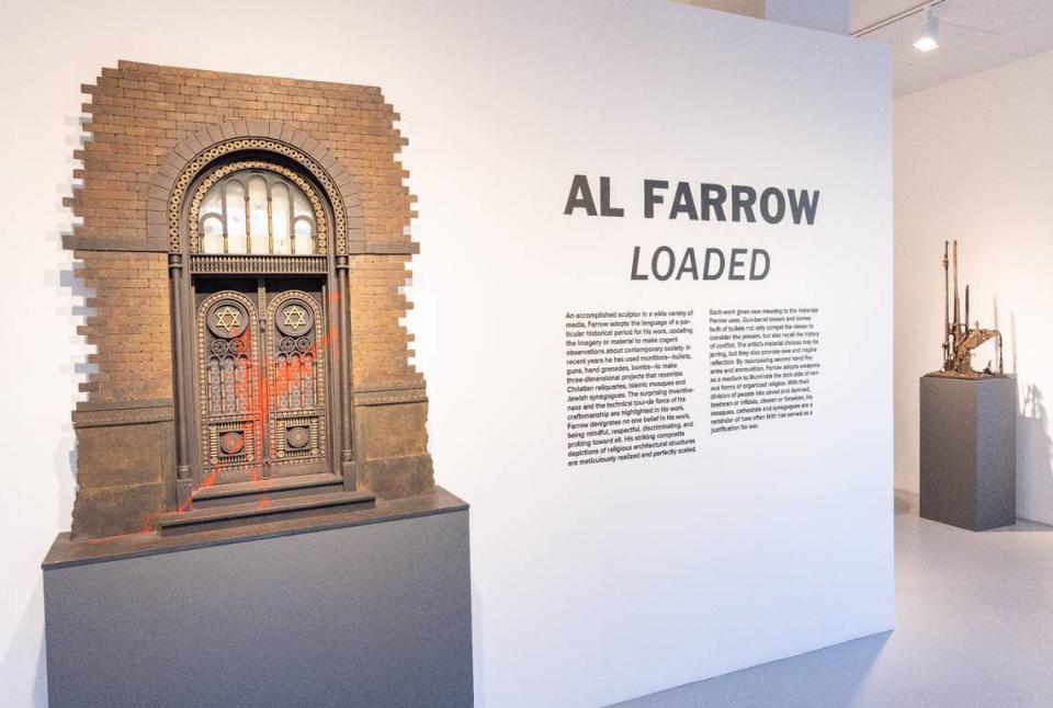 Artist Al Farrow’s solo exhibition “Loaded” at VISU Contemporary in South Beach explores the relationship between religion and acts of violence. On display is a recreation of a vandalized synagogue door.