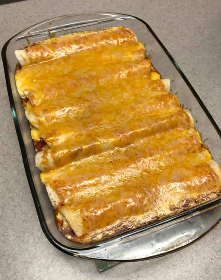 Taquito enchiladas in a baking dish.