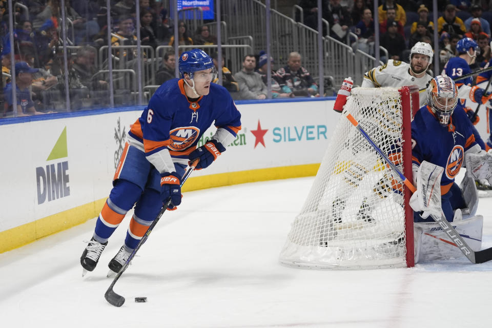 New York Islanders defenseman Ryan Pulock (6) skates with puck during the first period of an NHL hockey game against the Boston Bruins in Elmont, N.Y., Saturday, March 2, 2024. (AP Photo/Peter K. Afriyie)