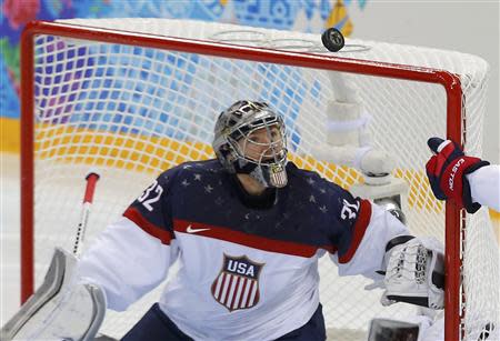 Team USA's goalie Jonathan Quick makes a save against Slovakia during the third period of their men's preliminary round hockey game at the 2014 Sochi Winter Olympic Games, February 13, 2014. REUTERS/Laszlo Balogh