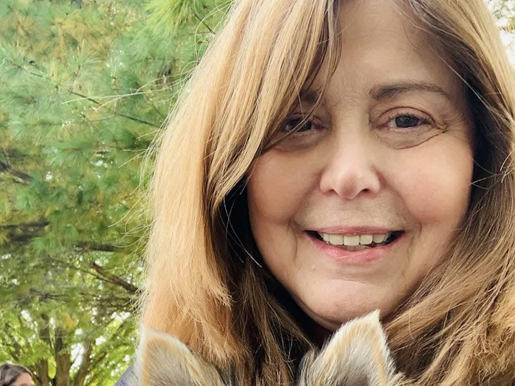 Marcia Frost holding her dog