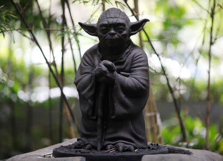 A statue of Yoda is pictured in Lucasfilm's Sandcrawler Building offices in Singapore May 22, 2019. REUTERS/Edgar Su