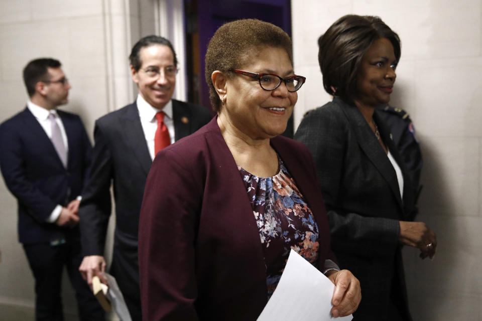 FILE - In this Dec. 9, 2019, file photo Rep. Karen Bass, D-Calif., center, walks out of a hearing room with Rep. Jamie Raskin, D-Md., second from left, and Rep. Val Demings, D-Fla., right, during a break as the House Judiciary Committee hears investigative findings in the impeachment inquiry of President Donald Trump on Capitol Hill in Washington. “Everything resides on Jan. 5 and whether or not we win those Senate seats,” Bass said. “If we do not win those Senate seats, then it is not going to be the full-force, full agenda that all of us would like to see take place.” Bass said President-elect Joe Biden could run into similar challenges President Barack Obama faced from a Republican-majority Senate that stalled much of his agenda. (AP Photo/Patrick Semansky, File)