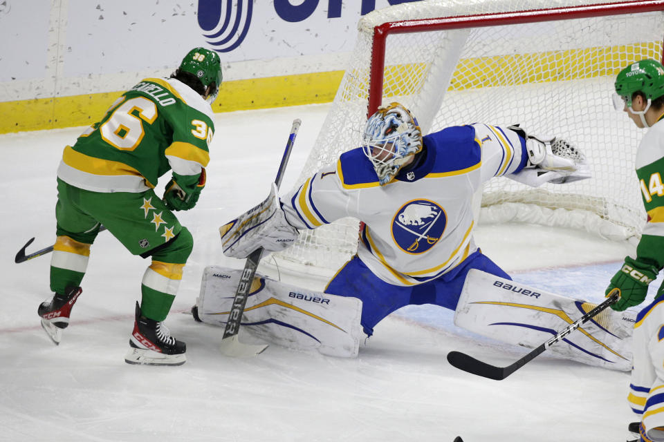 Buffalo Sabres goaltender Ukko-Pekka Luukkonen (1) stops a shot by Minnesota Wild right wing Mats Zuccarello (36) in the first period of an NHL hockey game Saturday, Jan. 28, 2023, in St. Paul, Minn. (AP Photo/Andy Clayton-King)