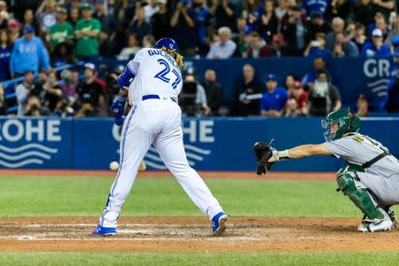 Apr 26, 2019; Toronto, Ontario, CAN; Toronto Blue Jays third baseman Vladimir Guerrero Jr. hits a double against the Oakland Athletics during the eighth inning at Rogers Centre. Mandatory Credit: Kevin Sousa-USA TODAY Sports