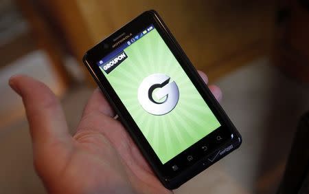 The Groupon smartphone app is displayed on a Motorola Droid Bionic cell phone in Denver November 4, 2011. REUTERS/Rick Wilking