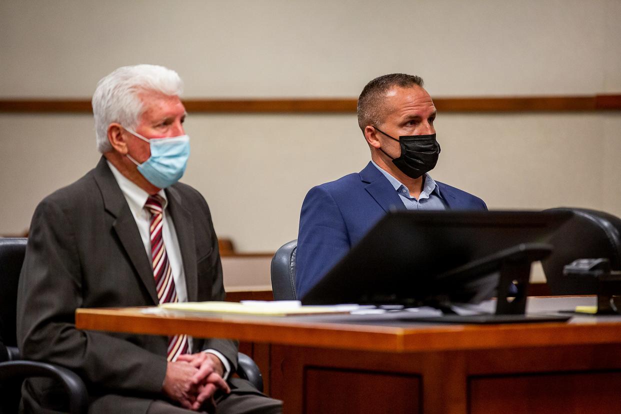 Former Louisville Metro Police detective Brett Hankison, right, and his attorney Stew Mathews listen to Circuit Judge Ann Bailey Smith during a pre-trial conference on Friday, where Judge Smith moved Hankison's trial to Feb. 1, 2022. April 23, 2021