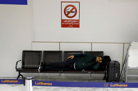 A passenger sleeps at the Tunis airport during a nationwide strike in Tunis, Tunisia January 17, 2019. REUTERS/Zoubeir Souissi