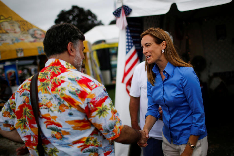 FILE PHOTO: US Democratic congressional candidate Mikie Sherrill (R) campaigns as people attend the New Jersey State Fair in Augusta, New Jersey, U.S., August 12, 2018. REUTERS/Eduardo Munoz/File Photo