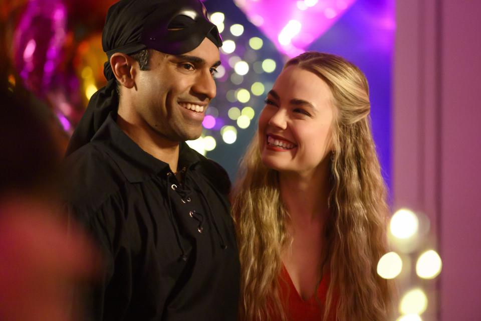 Kash (Nikesh Patel) with his fiancé Ainsley (Rebecca Rittenhouse)