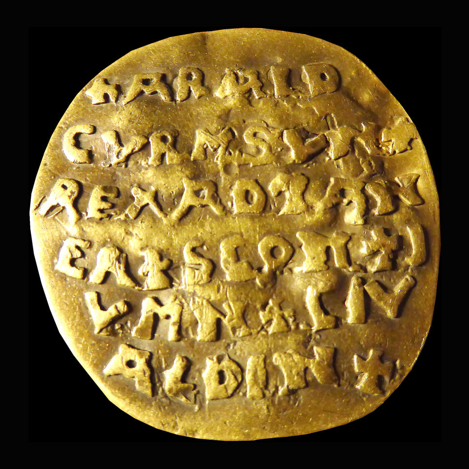 The 10th century golden Curmsun disc with the name of Danish King Harald “Bluetooth“ Gormsson (Curmsun in Latin) on it, coming from a tomb at the Roman Catholic church in Wiejkowo, Poland, photographed in Malmo, Sweden, in 2015. The Bluetooth wireless link technology is named after the king. More than 1,000 years after his death in what is now Poland, a Danish king whose nickname is known to the world through the Bluetooth technology is at the center of an archeological dispute. (Sven Rosborn via AP)