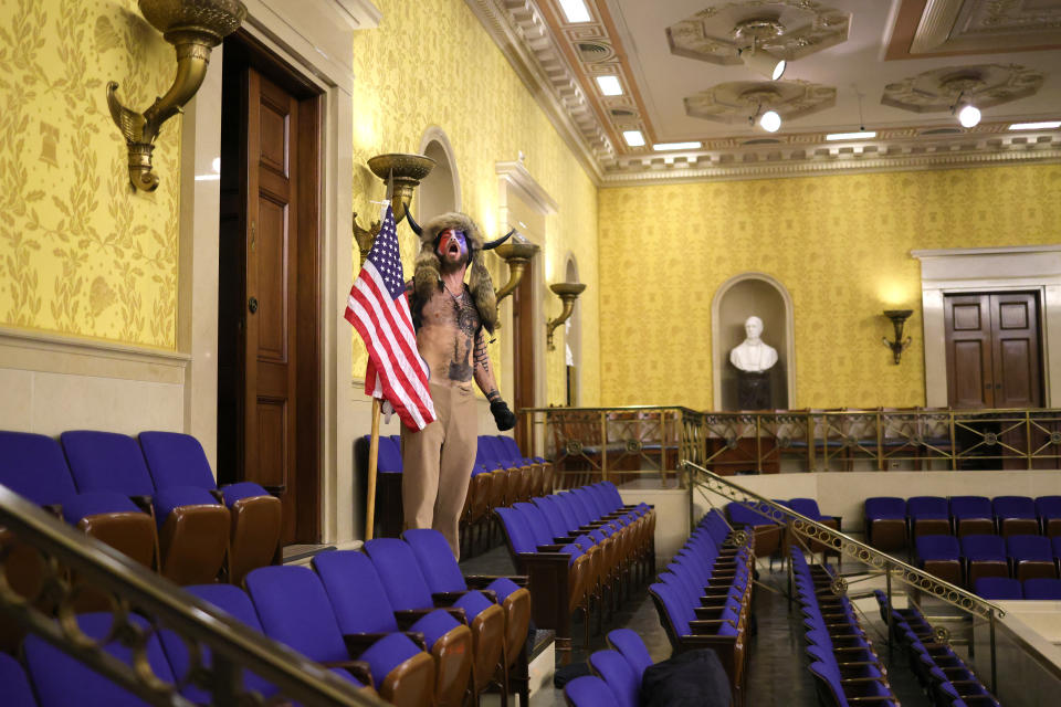 A protester screams "Freedom" inside the Senate chamber after the U.S. Capitol was breached by a mob during a joint session of Congress on January 06, 2021 in Washington, DC. 