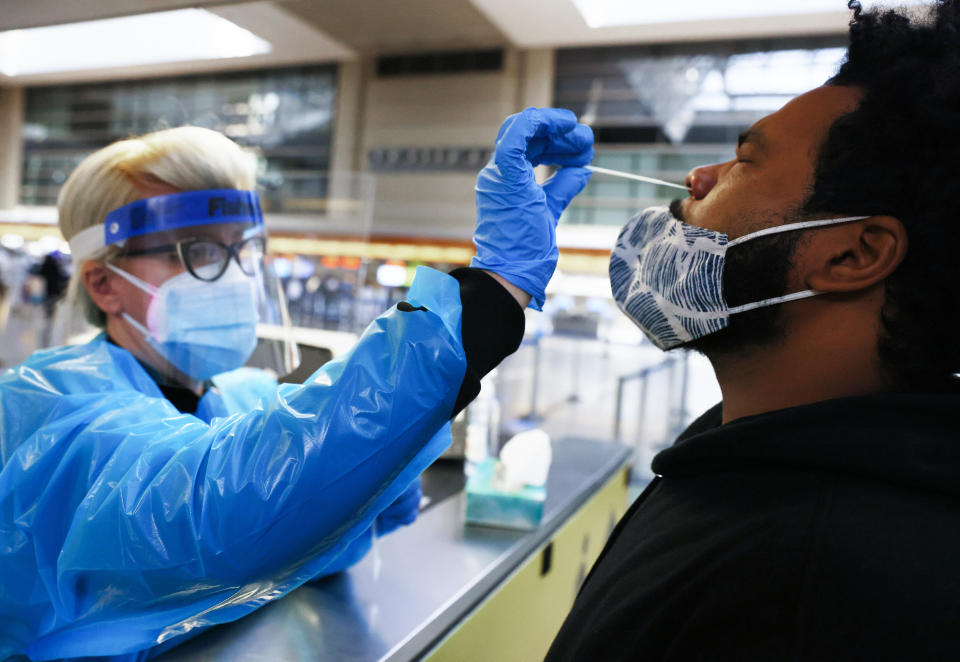 A man receives a nasal swab to test for COVID-19 at Los Angeles International Airport in December last year. 