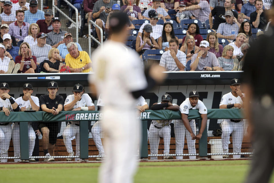 Vanderbilt players watch action during the seventh after Mississippi State went up 9-0 inning in Game 3 of the NCAA College World Series baseball finals, Wednesday, June 30, 2021, in Omaha, Neb. (AP Photo/Rebecca S. Gratz)