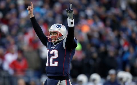 New England Patriots quarterback Tom Brady celebrates a touchdown run by running back Sony Michel during the first half of an NFL divisional playoff football game against the Los Angeles Chargers - Credit: AP