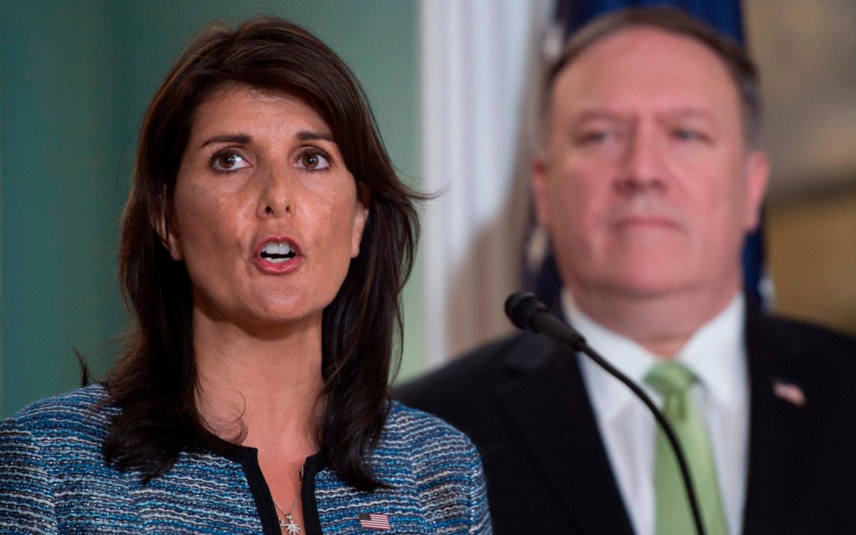 Nikki Haley, pictured beside Mike Pompeo, the secretary of state, announcing US withdrawal from the UN human rights council, on Tuesday in Washington DC - AFP