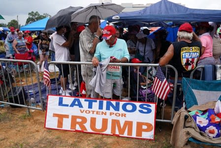 People attend a rally for U.S. President Donald Trump at the Amway Center in Orlando