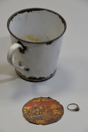 A mug where a gold ring was hidden is pictured at the Auschwitz Birkenau State Museum in Oswiecim, Poland May 19, 2016. Pawel Sawicki/Courtesy of Auschwitz Memorial/Handout via REUTERS