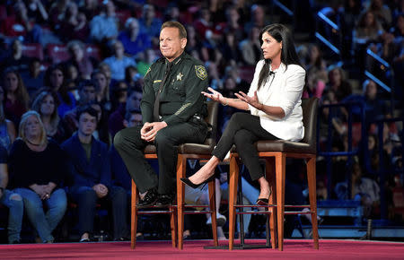 National Rifle Association spokesperson Dana Loesch (R) answers a question while sitting next to Broward Sheriff Scott Israel during a CNN town hall meeting, at the BB&T Center, in Sunrise, Florida, U.S. February 21, 2018. REUTERS/Michael Laughlin/Pool