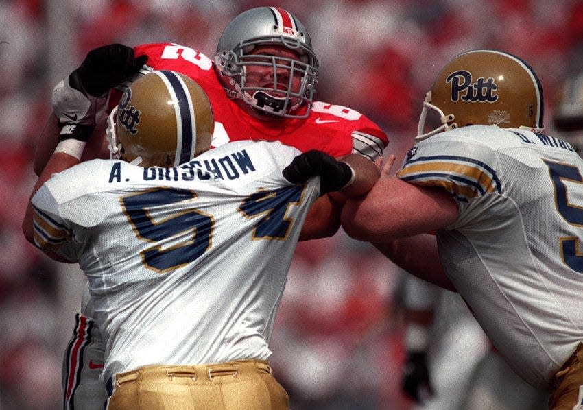 Ohio State's Shane Clark battles Pitt's Andrew Grischow in the second quarter of a 1996 game.