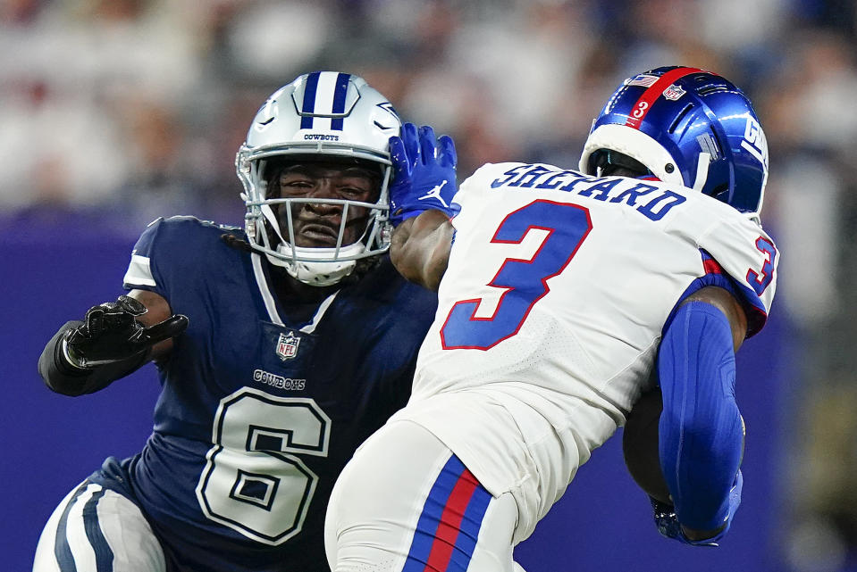 New York Giants wide receiver Sterling Shepard (3) tries to avoid a tackle by Dallas Cowboys safety Donovan Wilson (6) during the first quarter of an NFL football game, Monday, Sept. 26, 2022, in East Rutherford, N.J. (AP Photo/Frank Franklin II)