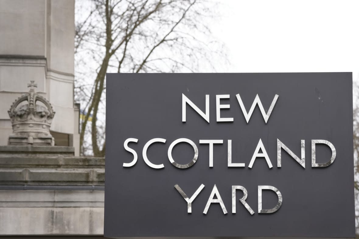 A sign outside New Scotland Yard, the headquarters of the London Metropolitan Police, in London, Tuesday, March 21, 2023. (AP Photo/Kirsty Wigglesworth)