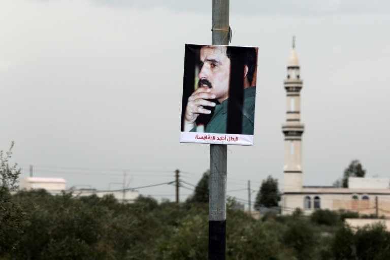 A portrait of Ahmad Dakamseh hangs in the Jordanian city of Irbid on the day of his release after serving 20 years in prison