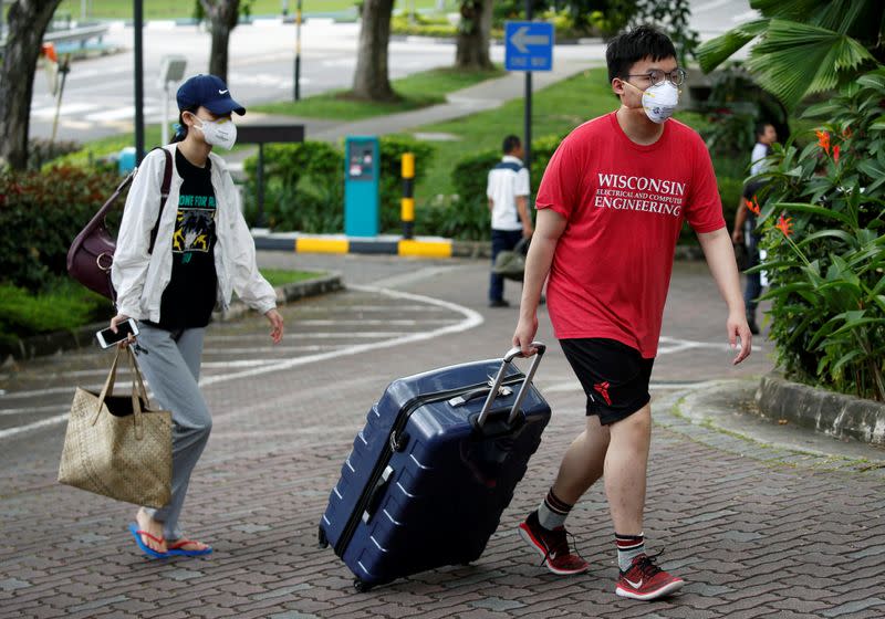 Students returning from China check in to a dormitory designated as a quarantine zone within Nanyang Technological University in Singapore