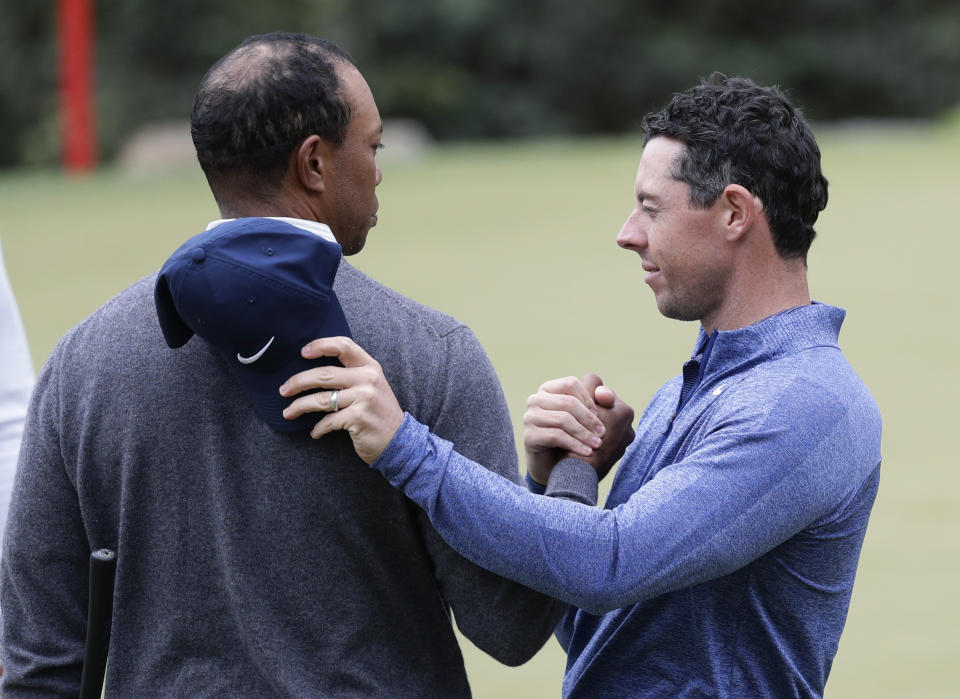 Tiger Woods, left, and Rory McIlroy, right, embrace after their match during fourth round play at the Dell Technologies Match Play Championship golf tournament, Saturday, March 30, 2019, in Austin, Texas. Woods won the match. (AP Photo/Eric Gay)