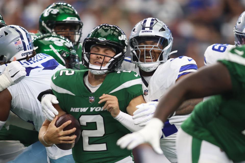 New York Jets quarterback Zach Wilson is sacked by Dallas Cowboys linebacker Micah Parsons.