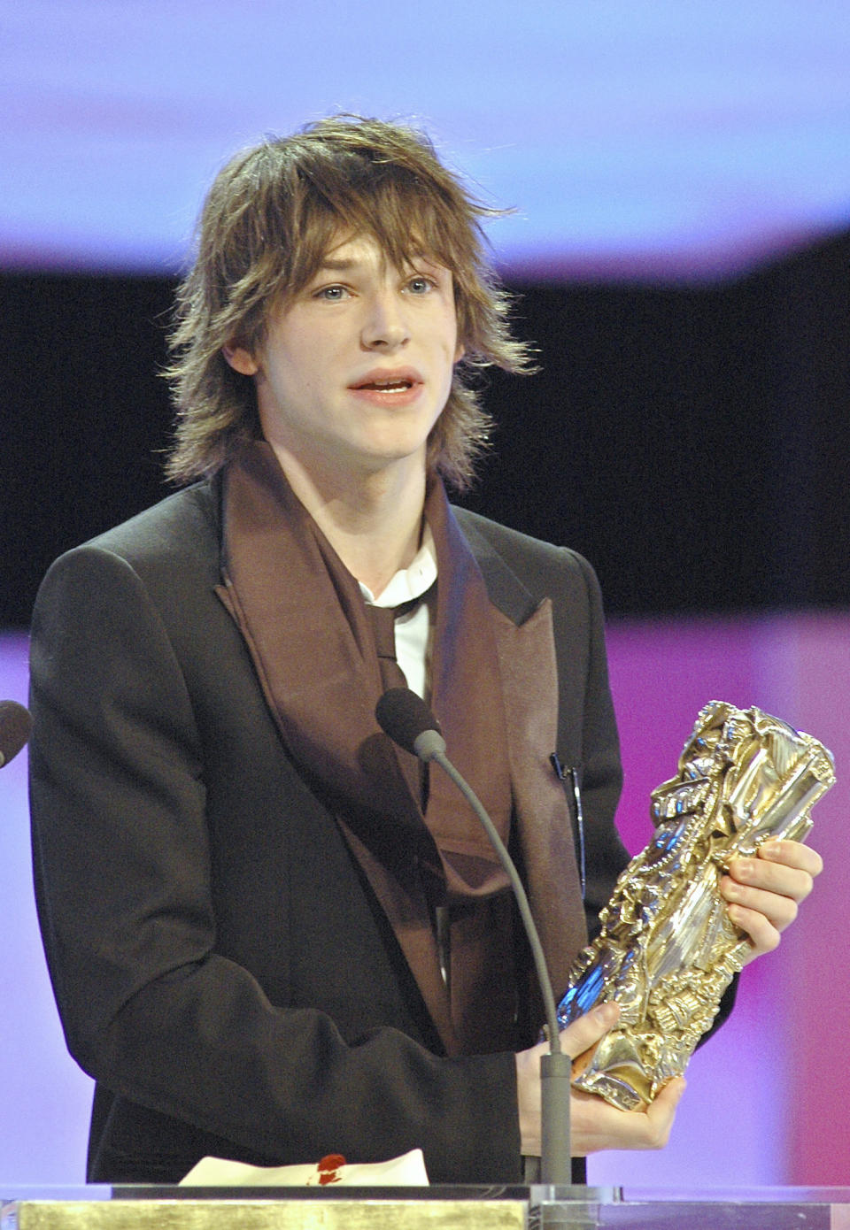 FILE - French actor Gaspard Ulliel accepts the Cesar Award for his performance as best young actor in "A Very Long Engagement" in Paris on Feb. 26, 2005. Ulliel died Wednesday, Jan. 19, 2022, after a skiing accident in the Alps, according to his agent's office. Ulliel, who was 37, was known for appearing in Chanel perfume ads as well as film and television roles. (AP Photo/Jacques Brinon, File)