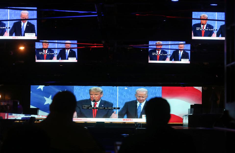 Viewers sitting outdoors in West Hollywood, California, watched Thursday's presidential debate on TV, as millions of Americans did.