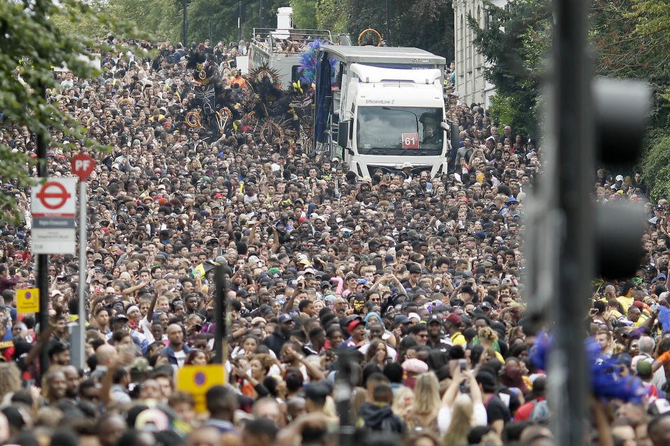 Crowds on Ladbroke Grove take part in the parade during the Notting Hill Carnival in London, Monday, Aug. 27, 2018. The carnival has been held every year since 1966 and one of the largest festival celebrations of its kind in Europe. (Photo: Tim Ireland/AP)