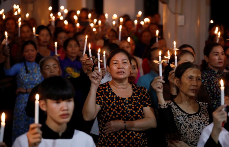 Catholics attend a mass prayer for 39 people found dead in the back of a truck near London, UK at My Khanh parish in Nghe An province