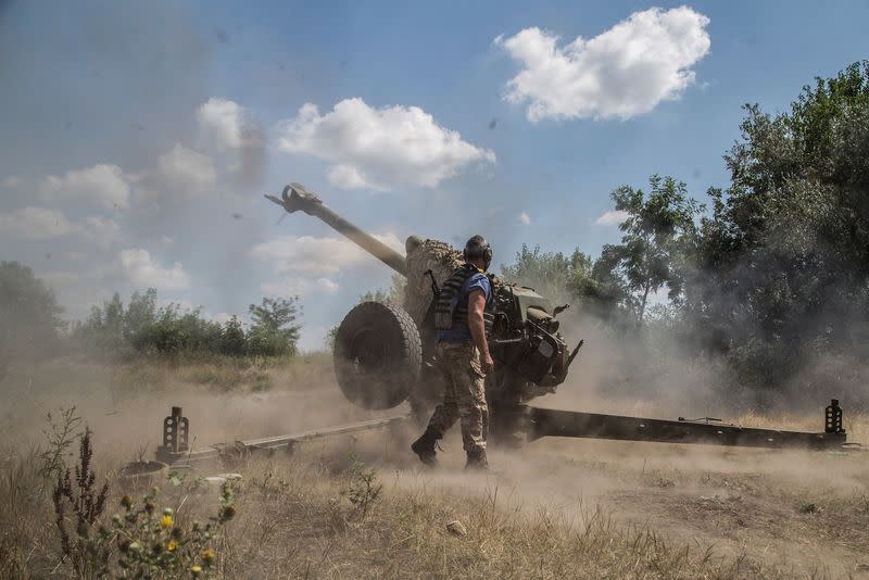 Ukrainian serviceman fires with a D-30 howitzer near a frontline in Mykolaiv region