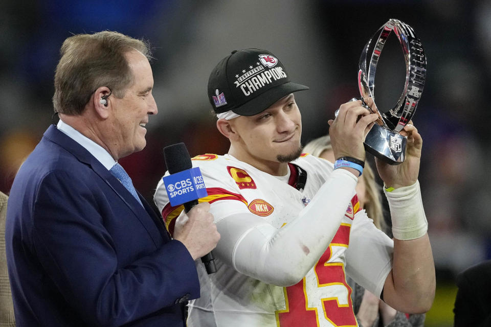 Patrick Mahomes holds Lamar Hunt Trophy after the Chiefs won the 2024 AFC championship game. (Nick Wass / AP)