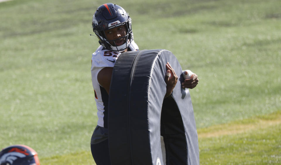 Denver Broncos linebacker Justin Hollins takes part in drills during an NFL football practice Thursday, Sept. 3, 2020, in Englewood, Colo. (AP Photo/David Zalubowski)