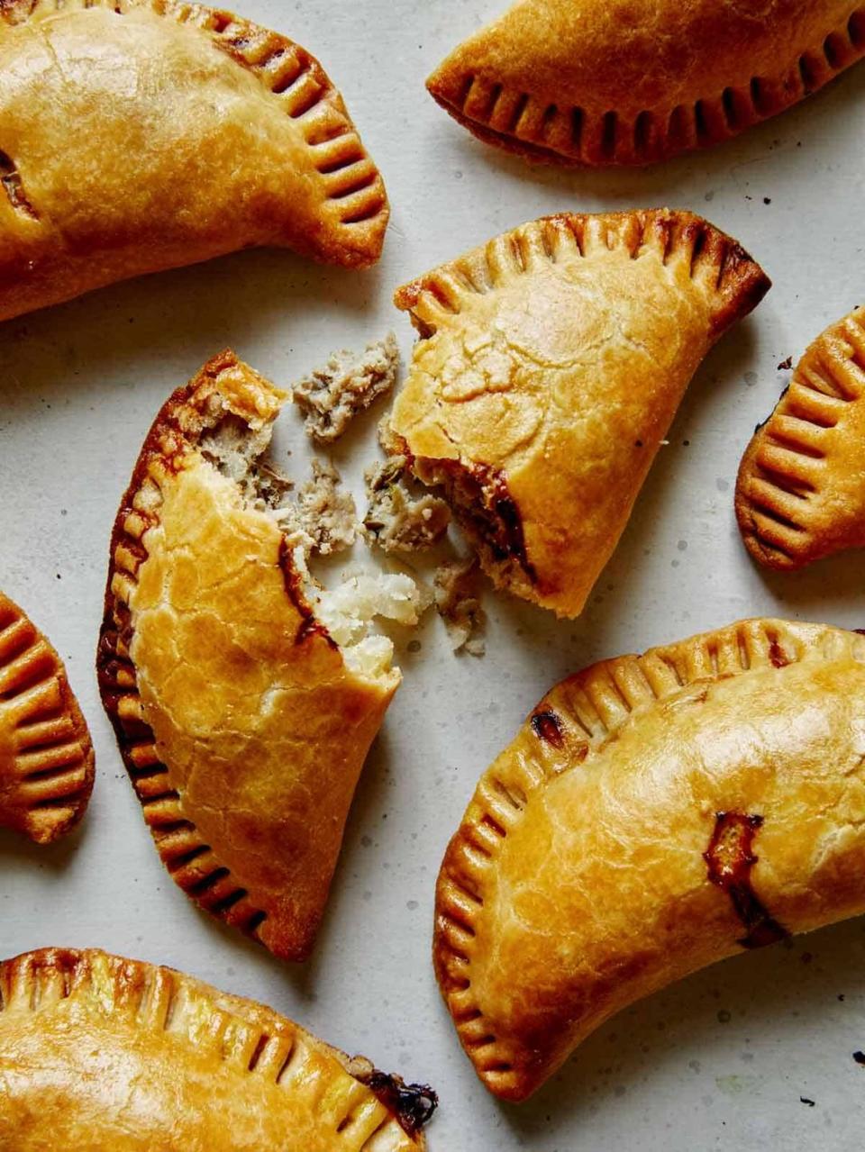 a group of pastries with powdered sugar on top